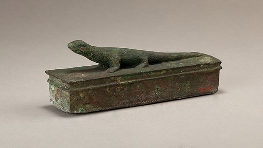 Shrine-shaped case for an animal mummy surmounted by a lizard