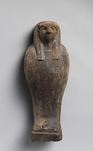 Falcon-headed coffin and grain mummy with Osiris mask