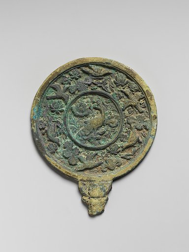 Mirror with handle and decorated with peacock, flowers, and birds