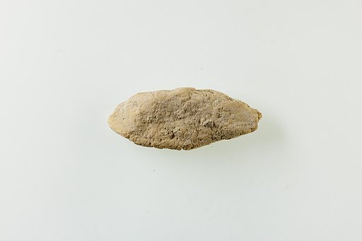 Fragment of clay lump with impressions of beads