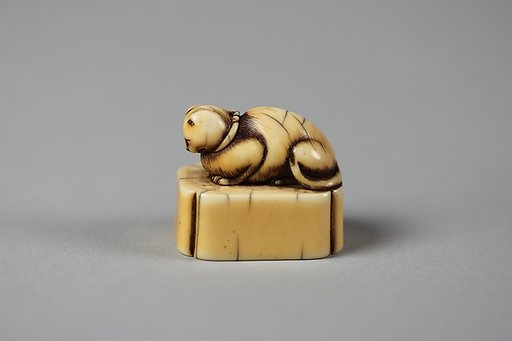 Netsuke of Cat on a Seal-Shaped Base