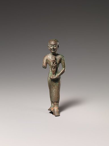 Standing man holding statuette of Nebethetepet or Nehemetaway
