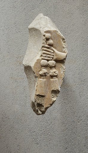 Relief of a hand with part of necklace - see 26.3.353-3
