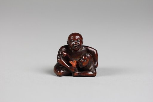 Netsuke of a Man Holding a Mermaid