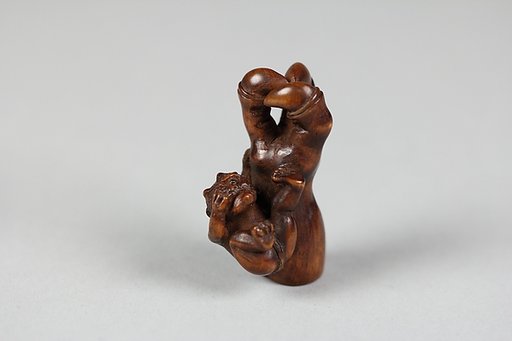 Netsuke of Ōni (Demon) Weeping Beside Giant Arm of Demon