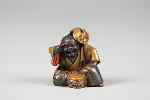 Netsuke of Boy with a Mask