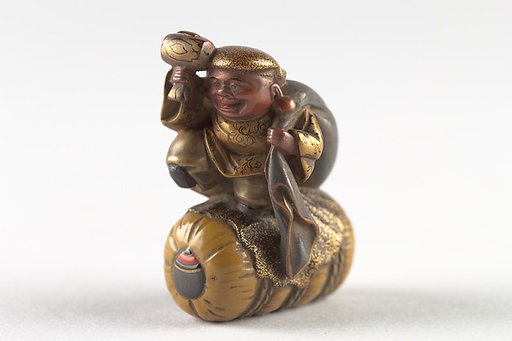 Netsuke of Daikoku and Bag on Rice Bale