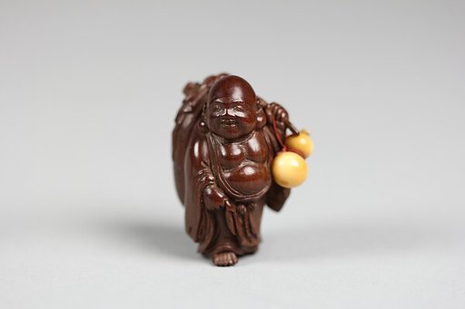 Netsuke of Hotei with Bag and Gourd