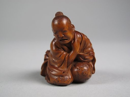 Netsuke of Man Applying Salve