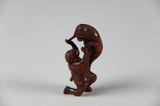 Netsuke of Ghost and Man on His Knees