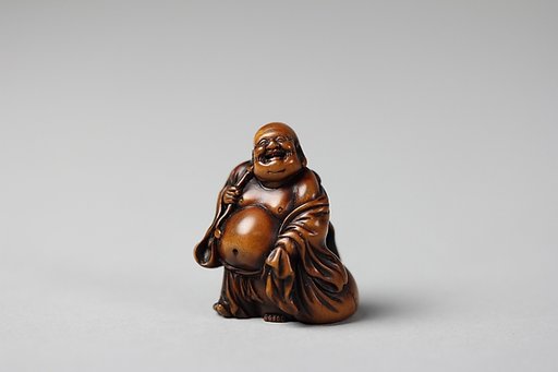 Netsuke of Hotei and Bag with Fan