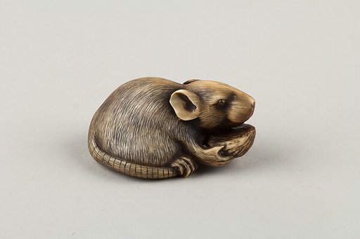 Mouse Eating a Pit