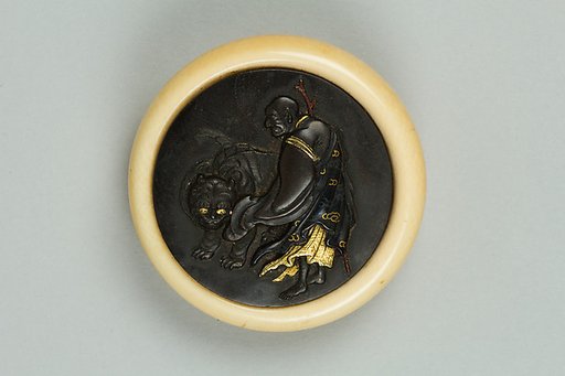 Netsuke of Luohan with a Tiger