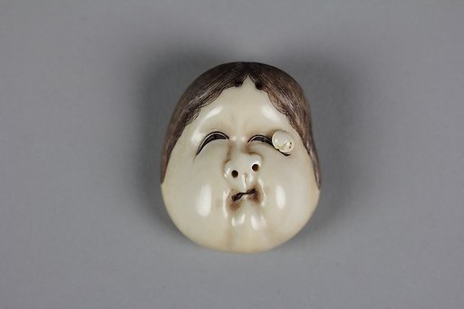Netsuke of Okame with Wart Mask