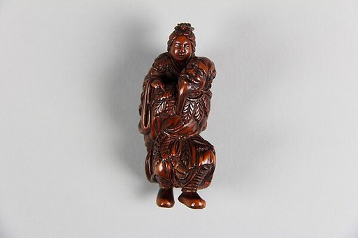 Netsuke of Old Man Carrying a Woman on His Back
