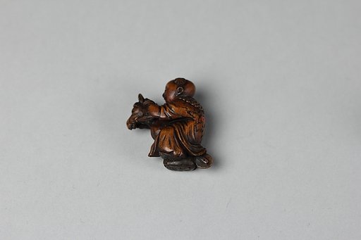Netsuke of Boy Riding a Hobby Horse