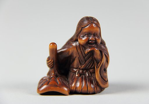 Netsuke of Girl with a Mask