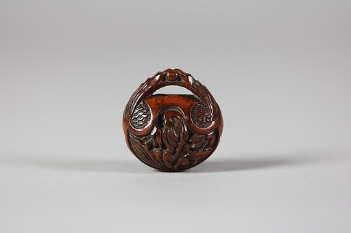 Netsuke in the form of a Nut Containing a Carved Landscape