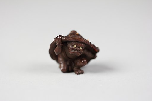 Netsuke of Demon under a Lotus
