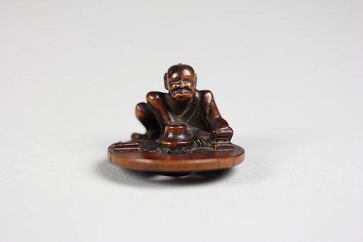 Netsuke of a Wheel Maker
