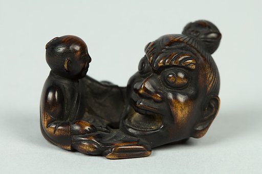 Netsuke of Sculptor Modelling a Large Head