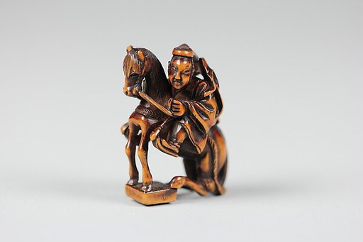 Netsuke of Equestrian Figure on a Go Board