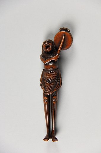 Netsuke of Ashinaga Beating a Drum