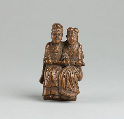 Netsuke of Man and Woman Sitting on a Box