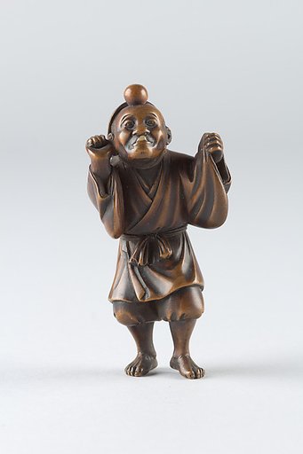 Netsuke of Boy Wearing a Mask