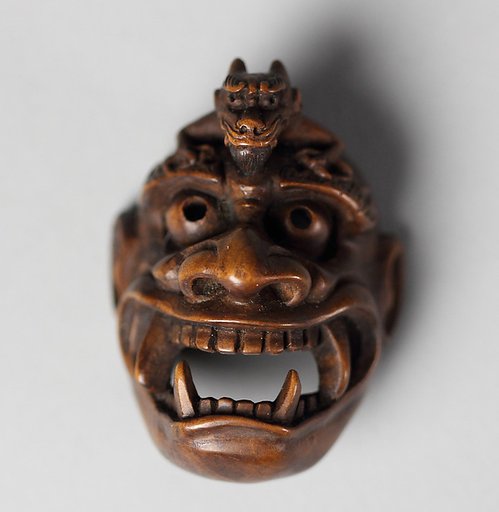 Netsuke of Demon Mask Derived from Bugaku