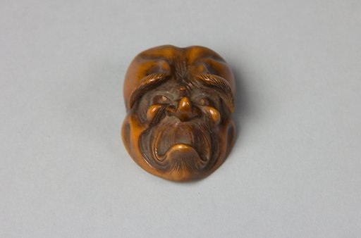 Netsuke: Mask of Unhappy Old Man
