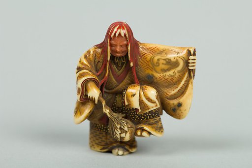 Netsuke of Noh Dancer with Long Red Hair and Peony