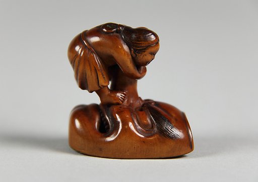 Netsuke of Mask; Uzume (Okame) and a Tengu mask
