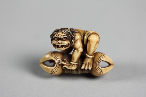 Netsuke of Ōni on Vadra, Crouching
