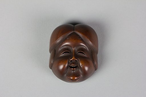 Netsuke of Noh mask; Face of Usume