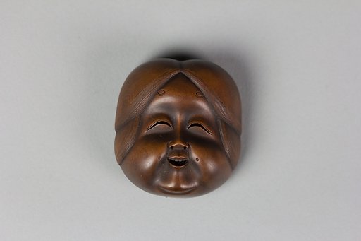 Netsuke of Kyōgen Mask: Usume (or Ofuku or Okame)