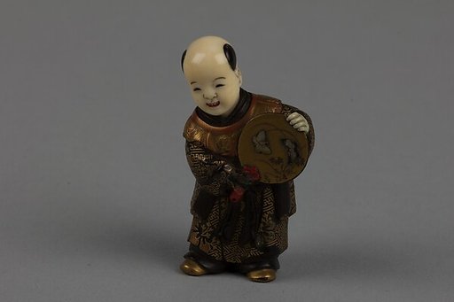 Netsuke of Boy with a Fan
