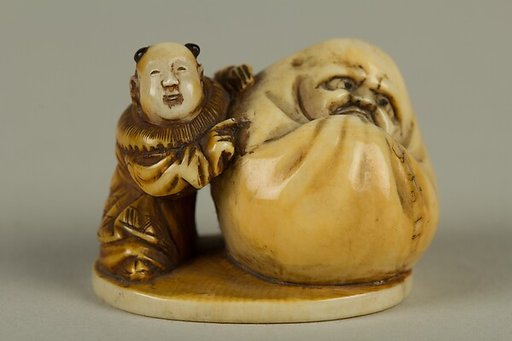 Netsuke of Dharma with a Small Boy