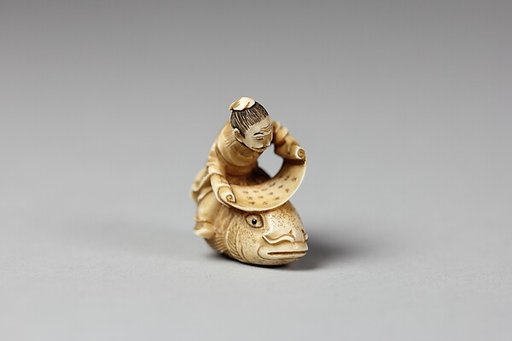 Netsuke of the Sage, Kinkō Carrying a Scroll and Seated on a Carp