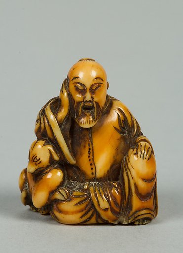 Netsuke of Seated Figure of Old Man with a Dog
