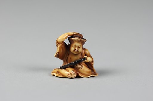 Netsuke of Girl at her Toilet