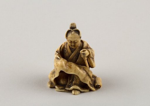 Netsuke of Woman Reading from a Scroll