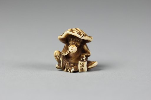 Netsuke of Monkey with Lotus Leaf Hat