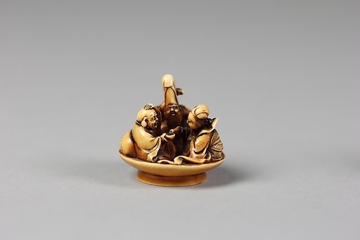 Netsuke of Fukurokujin, Hotei and Benten in Sake Dish