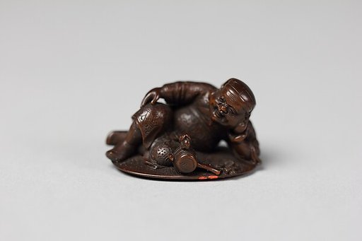 Netsuke of Daikoku and Mallet on Coin