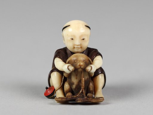 Netsuke of Boy Playing with a Dog