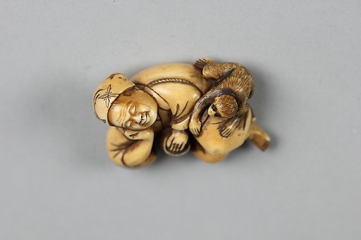 Netsuke of Sleeping Man and a Monkey