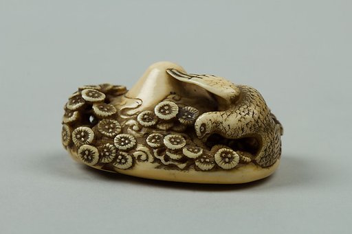 Netsuke of Mountain with Flowers and a Bird