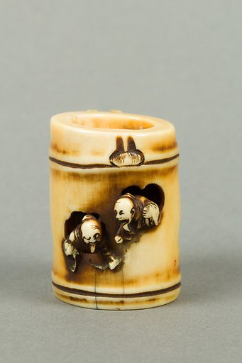 Netsuke of Section of Bamboo Containing Two Men