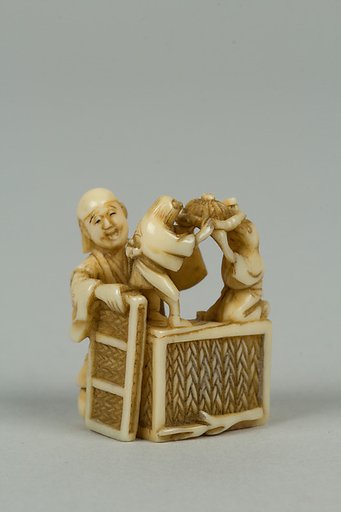 Netsuke of Man Training Birds